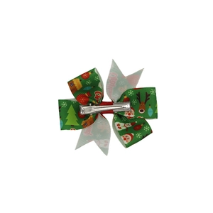 Weihnachts-Haarspange für Mädchen mit Motiven von Weihnachtsmann und Rentier auf weißem Grund