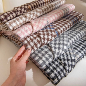 Thick houndstooth scarf collection in various colors with soft woven texture and fringe