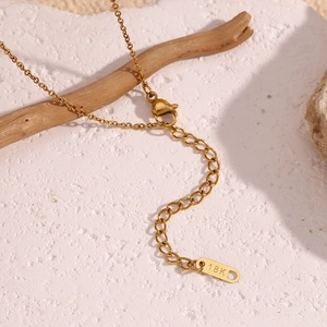 Detail of 18K gold-plated starfish necklace with lobster clasp and extension chain