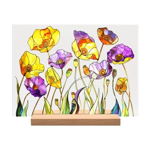 Detail of colorful acrylic floral plaque with a natural wooden base for desk decor