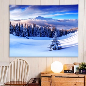 Detail of winter snow mountain tapestry with soft lighting and cozy interior decor