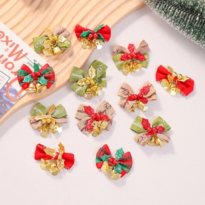 Christmas burlap bow ornaments with gold bells and festive greenery for tree decoration