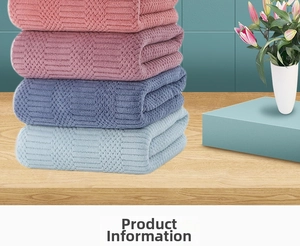 Detail of coral fleece towels with absorbent waffle weave in four soft pastel colors