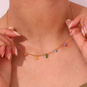 Close-up of 18K gold plated necklace with vibrant rainbow zircon gemstone charms