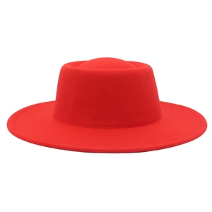 Detailed view of the wide brim and flat crown of the red cashmere felt fedora hat