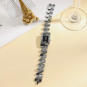 Chic silver quartz watch featuring a rectangular black dial and unique Z-shaped bracelet