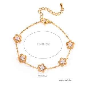 Detail shot of golden star charm bracelet with clear zircons on white background