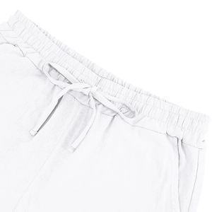 Detailed macro view of white cotton linen shorts featuring an adjustable drawstring waistband
