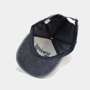 Interior view of washed cotton baseball cap with neat stitching and adjustable strap