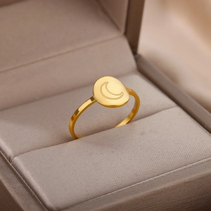 Macro view of a 18K gold plated stainless steel signet ring with engraved crescent moon detail