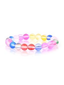 Macro detail of rainbow colored matte beaded bracelet with frosted natural stones on white back