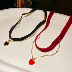Double-layered velvet choker necklace with glossy heart pendants in black and red colors