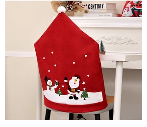 Christmas chair cover featuring Santa Claus and snowman patterns in a festive room setting