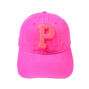 Detailed close-up of pink baseball cap featuring a premium textured letter P towel patch
