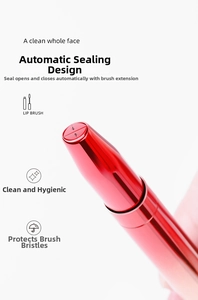 Detail of red retractable lip brush showing the automatic dust-proof sealing mechanism