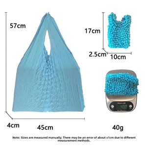 Size comparison of light blue stretch pleated tote bag in expanded and folded states