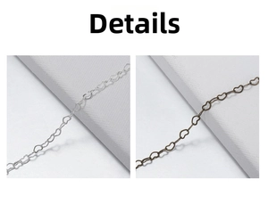 Detail of hollow heart-shaped chain links in silver and antique bronze finishes