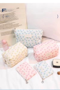Floral lace makeup bag set featuring shell charms and a vertical partitioned storage design