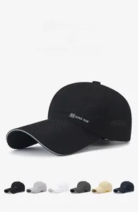 Detail view of laser-perforated breathable fabric and reflective brim on baseball cap