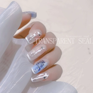 Transparent nail seal kit with white relief lines and blue watercolor rhinestone designs