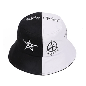 Streetwear bucket hat with black and white split design and graffiti style embroidery