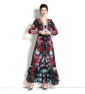 Close-up of floral print dress with deep V-neck and colorful ethnic trim details