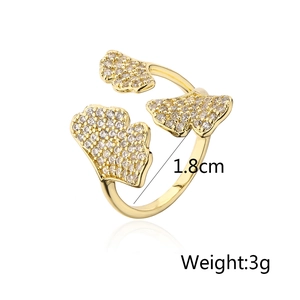 Macro shot of 18K gold plated ginkgo leaf ring with white zircon pave setting