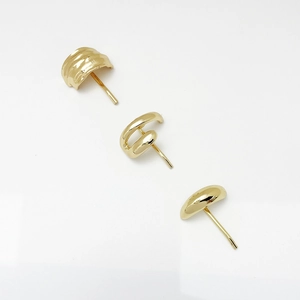 Three-piece set of polished gold-finish earrings with wavy, twisted, and smooth designs