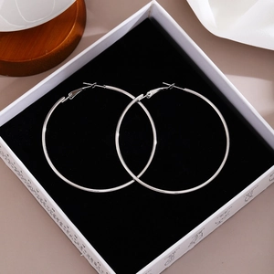 Silver large hoop earrings displayed in a premium jewelry gift box with velvet lining