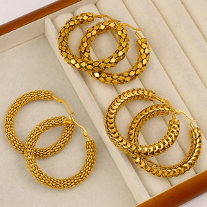 Three pairs of 18K gold plated hoop earrings with diverse textures in a velvet jewelry box