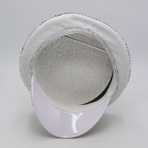 Top-down view of white sequin party hat with silver spikes and inner lining detail