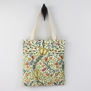 William Morris floral canvas tote bag with red yellow flower pattern and beige handle