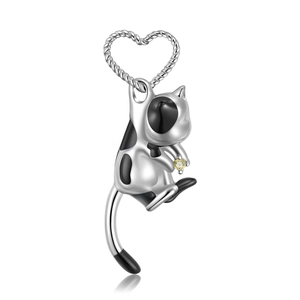 Detail of S925 silver tuxedo cat pendant featuring a yellow gemstone and heart-shaped bail