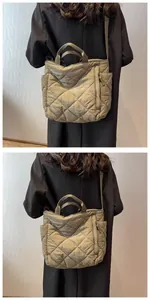 Detail view of khaki green quilted puffer tote bag with large diamond stitching patterns