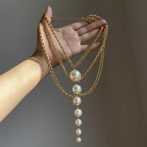 French vintage multi-layer gold chain necklace featuring a gradient pearl pendant design