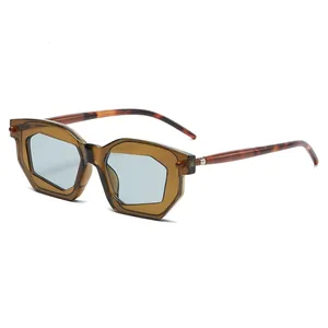 Retro geometric hexagonal sunglasses with brown frame and light blue lenses for street style