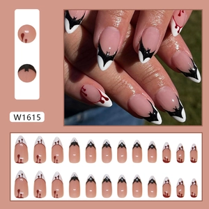 Short almond Halloween press-on nails with black bat French tips and red blood drip designs