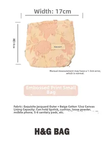 Detail view of pink floral embossed makeup bag with dimensions 17cm by 14cm