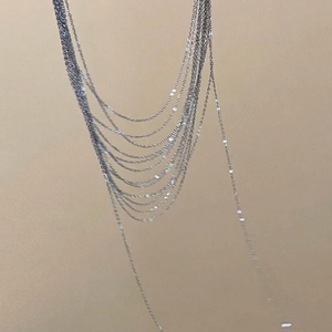 Elegant multi-layered silver tassel necklace with delicate fringe chain for women