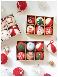 Festive felt wool ball ornaments set featuring snowman and gingerbread man in a gift box