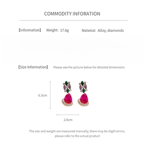 Detailed size and weight specs for vintage diamond-encrusted drop earrings on white background