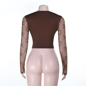 Detail of dark brown slim-fit top featuring sheer lace sleeves and back stitching