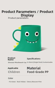 Macro shot of green dinosaur cartoon mouthwash cup with ergonomic handle for kids