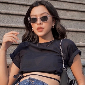 Slim fit black tie-waist crop top with short sleeves and denim jeans outdoor street style