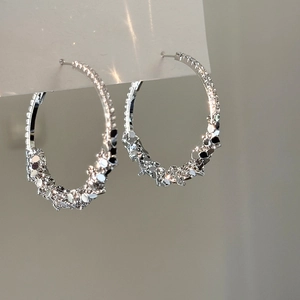 Polished silver-tone round earrings with a textured crushed silver finish for women