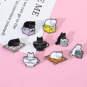 Detail of eight cute cat enamel pins featuring kittens with books and coffee cups