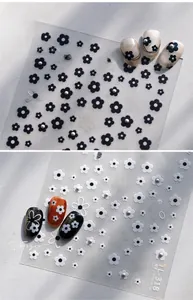Detail of TL-318 nail art stickers with black and white floral patterns and 3D pearls