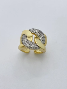 Macro view of two-tone gold and silver ring with sparkling cubic zirconia inlays