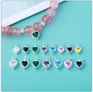 Macro shot of colorful micro-paved zircon heart pendants with s925 silver hardware