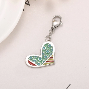 Close-up of heart-shaped stainless steel pendant with colorful enamel and lobster clasp